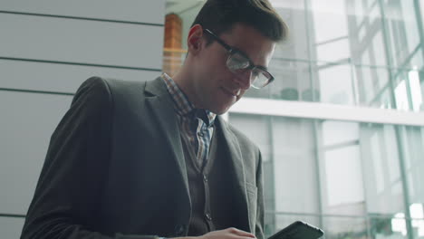 Young-Businessman-Using-Smartphone