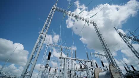 high voltage transformer against the blue sky. electric current redistribution substation