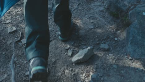 close up footage of hiking boots, trekking in the forrest of jasper national park in canada