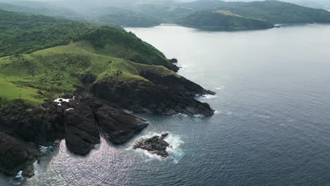 the lush baras landscapes in catanduanes with rocky coastline and ocean, aerial view