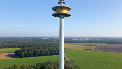 radio and tv tower overlooking vast green fields in dotternhausen, germany