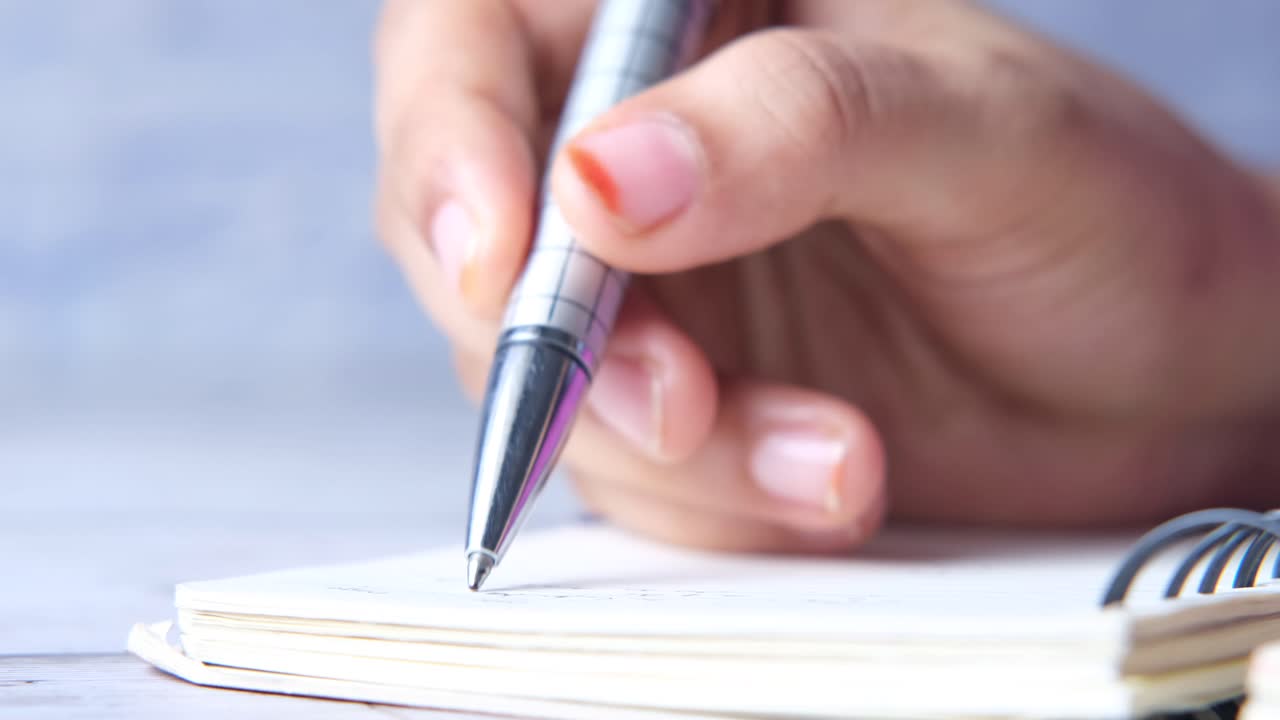 Hand writing in a notebook