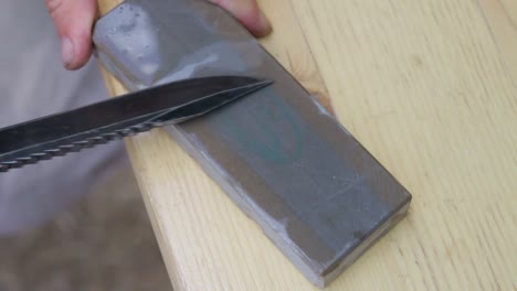 sharpening a knife using a wet stone method