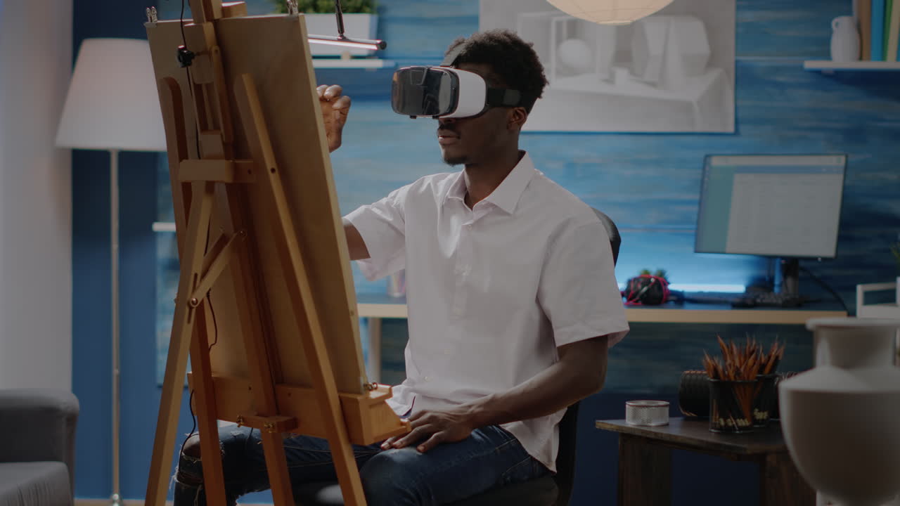Artist of african american ethnicity using vr glasses for art