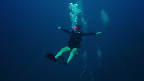 scuba diver in deep blue water
