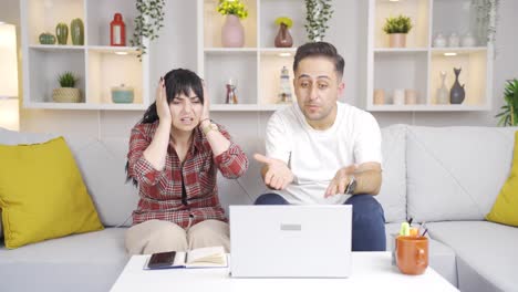 The-couple-is-upset-by-what-they-see-on-the-laptop.