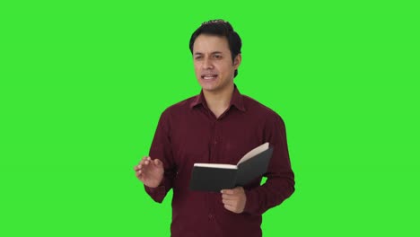 Happy-Indian-teacher-teaching-in-class-Green-screen