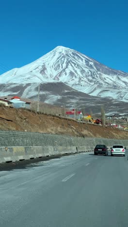 winter season damavand mountain road volcano peak trip adventure alpine car countryside drive forest highway iran landscape nature outdoor pass people ride scenic sky snow tourism travel valley