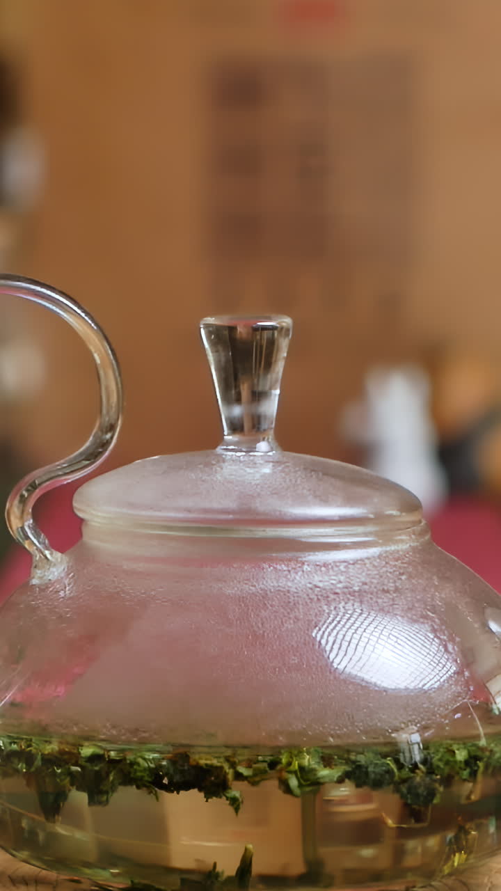 Glass Teapot with Tea Leaves