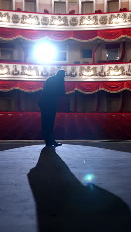 empty raws in theater. actor bows down in front of empty auditorium. cancellation of mass events to prevent spread of coronavirus infection. vertical video