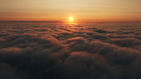 sunrise or sunset over a cloud sea