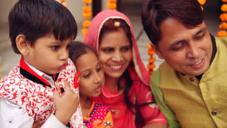 parents with kids celebrate the indian traditional festival of diwali