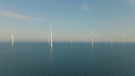 huge windmill turbines, offshore windmill farm in the ocean westermeerwind park , windmills isolated at sea on a beautiful bright day netherlands flevoland noordoostpolder