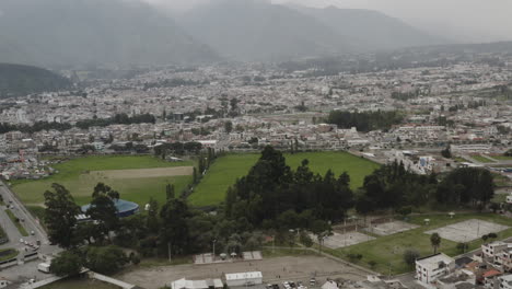 cityscape with mountains and green space