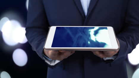 Businessman holding tablet computer with blue design animation on screen 4K