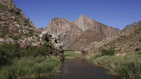 aerial river and mountain range tracking 4k