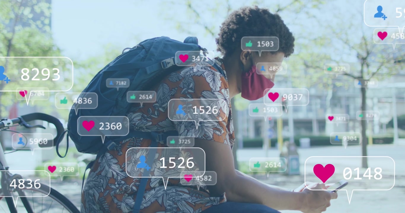 Animation of social media icons over african american woman with face mask using smartphone
