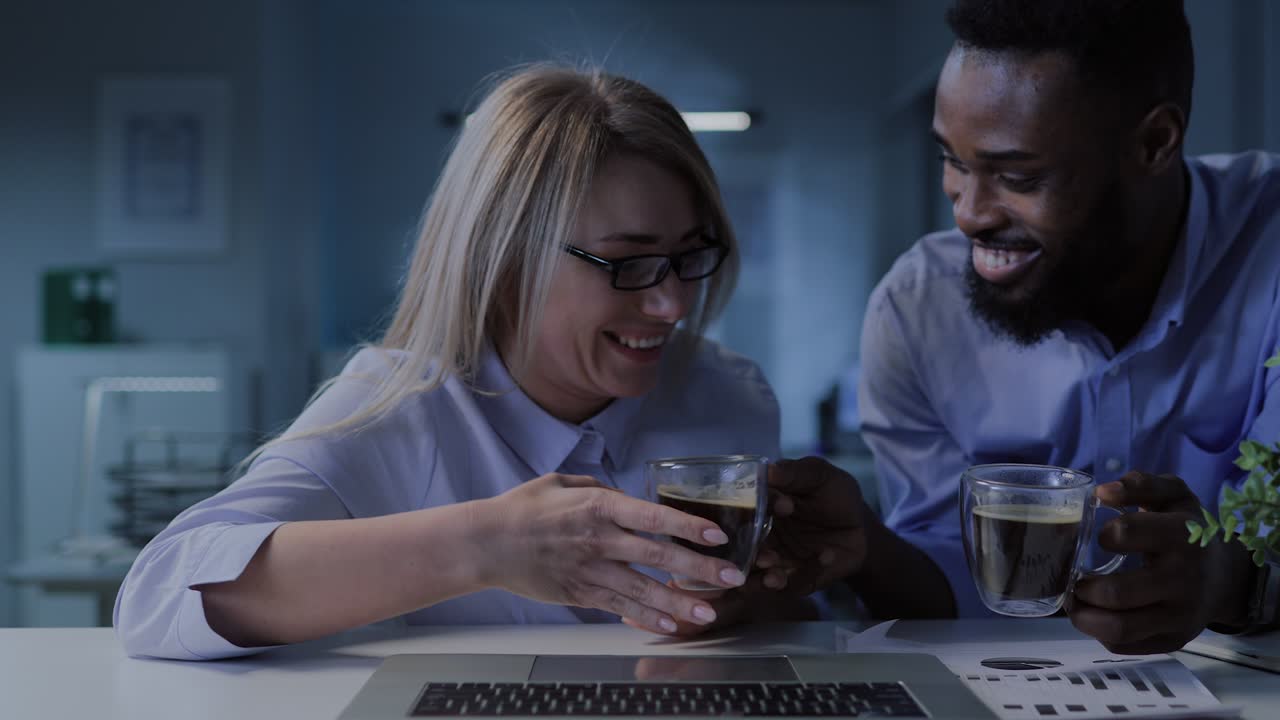 African-American colleague bring coffee to businesswoman and work together in office