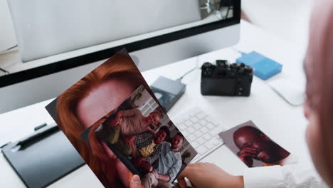 photographer holding pictures