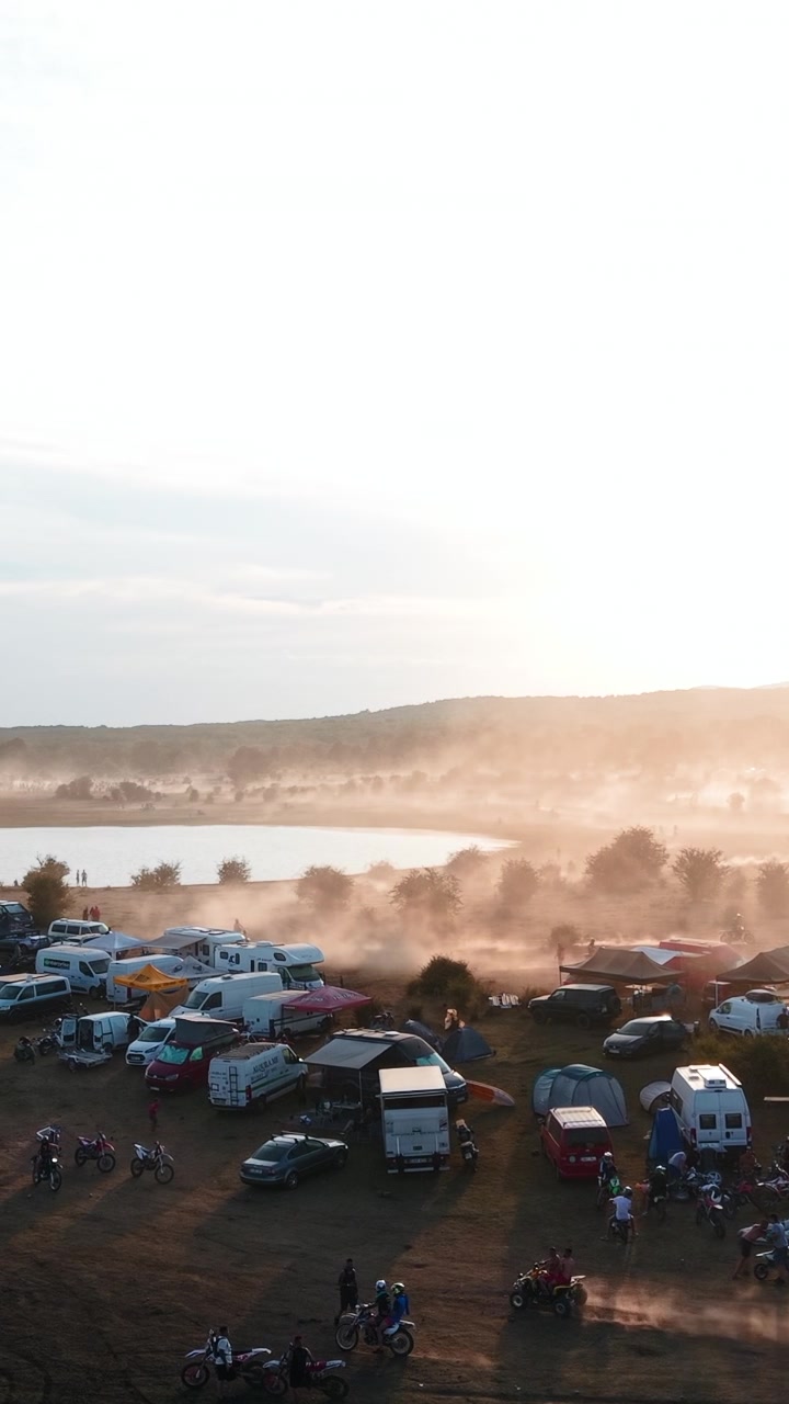 Aerial View of Motocross Camp at Sunset Near a Lake