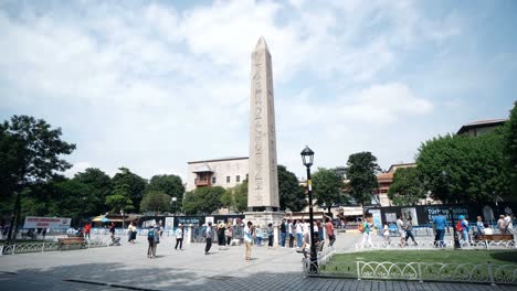 tourists visiting obelisk of theodosius in sultanahmet square in fatih, istanbul. turkey