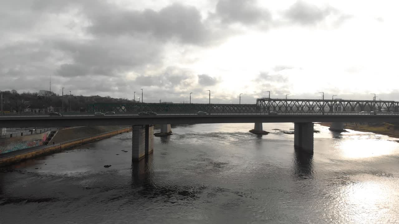 Morning time view over a traffic on the bridge with people driving cars to work