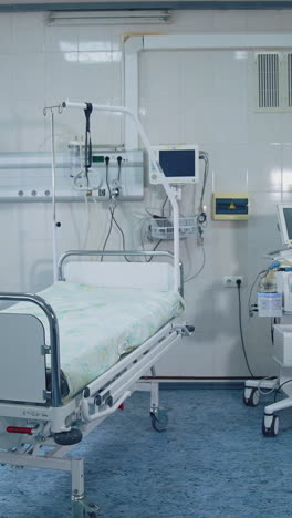 reanimation ward with modern equipment in hospital. hospital room with contemporary medical equipment for saving patient's life during pandemic. covid-19. vertical video