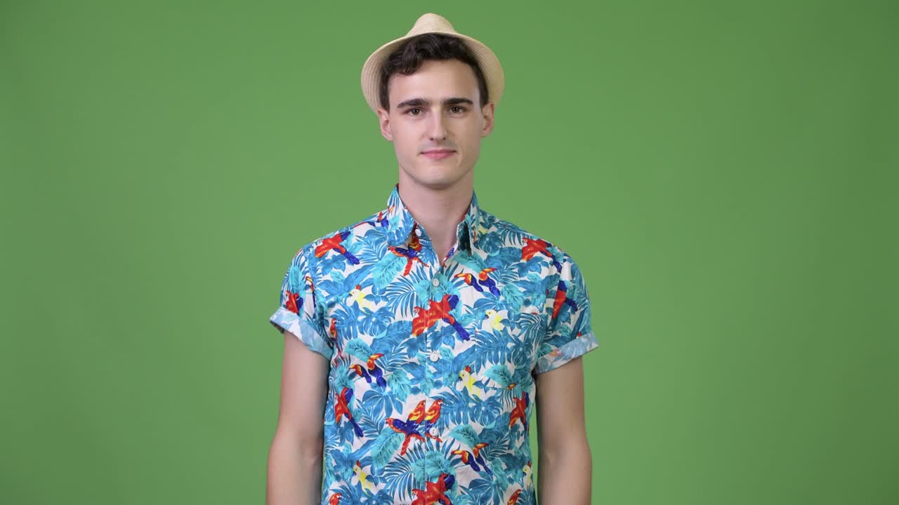 Young happy handsome tourist man smiling