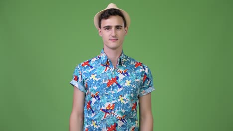 young happy handsome tourist man smiling