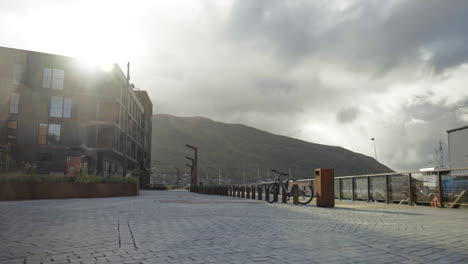 Walking-In-Cobblestone-Promenade-In-Tromso-On-A-Cloudy-Day-In-Norway