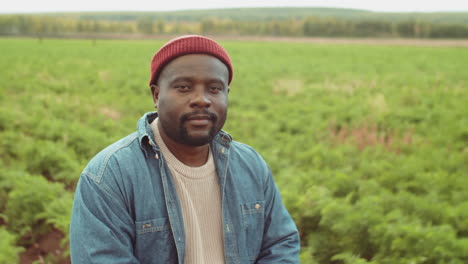 portrait of african american man on farm field