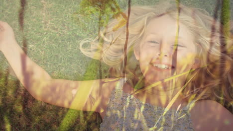 little girl lying on a field of grass