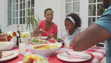 happy family eating together at table