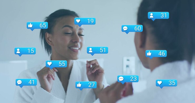 Mid-adult woman massaging facial cream at bathroom mirror while monitoring social media alerts