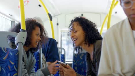 Commuters-interacting-with-each-other-while-travelling-in-bus-4k