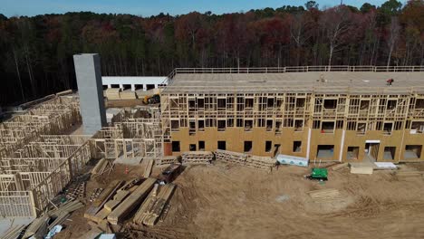 Wooden Building under Construction Amidst a Quiet Forest Emphasize the Contrast between the New Wooden Building under Construction Amidst a Quiet Forest Emphasize the Contrast between the New Building and the Lush Greenery