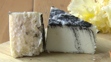 sliced aged cheese with black mold