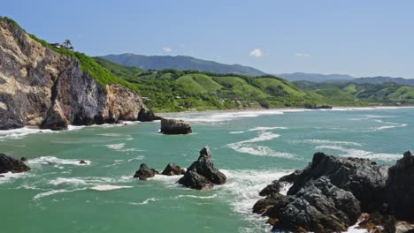 Aerial:-flight-over-coastal-rocks-and-rugged-cliffs-on-Pacific-Coast