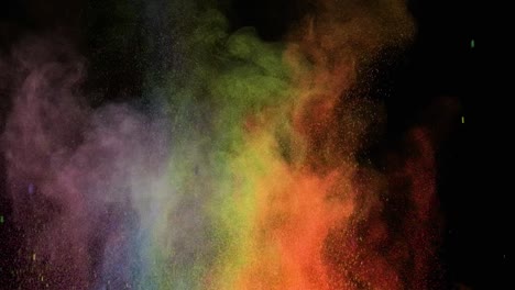 the bright colorful explosion of small particles. slow motion