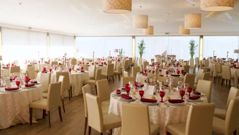 luxurious indoor wedding tables with flowers candles and chandeliers