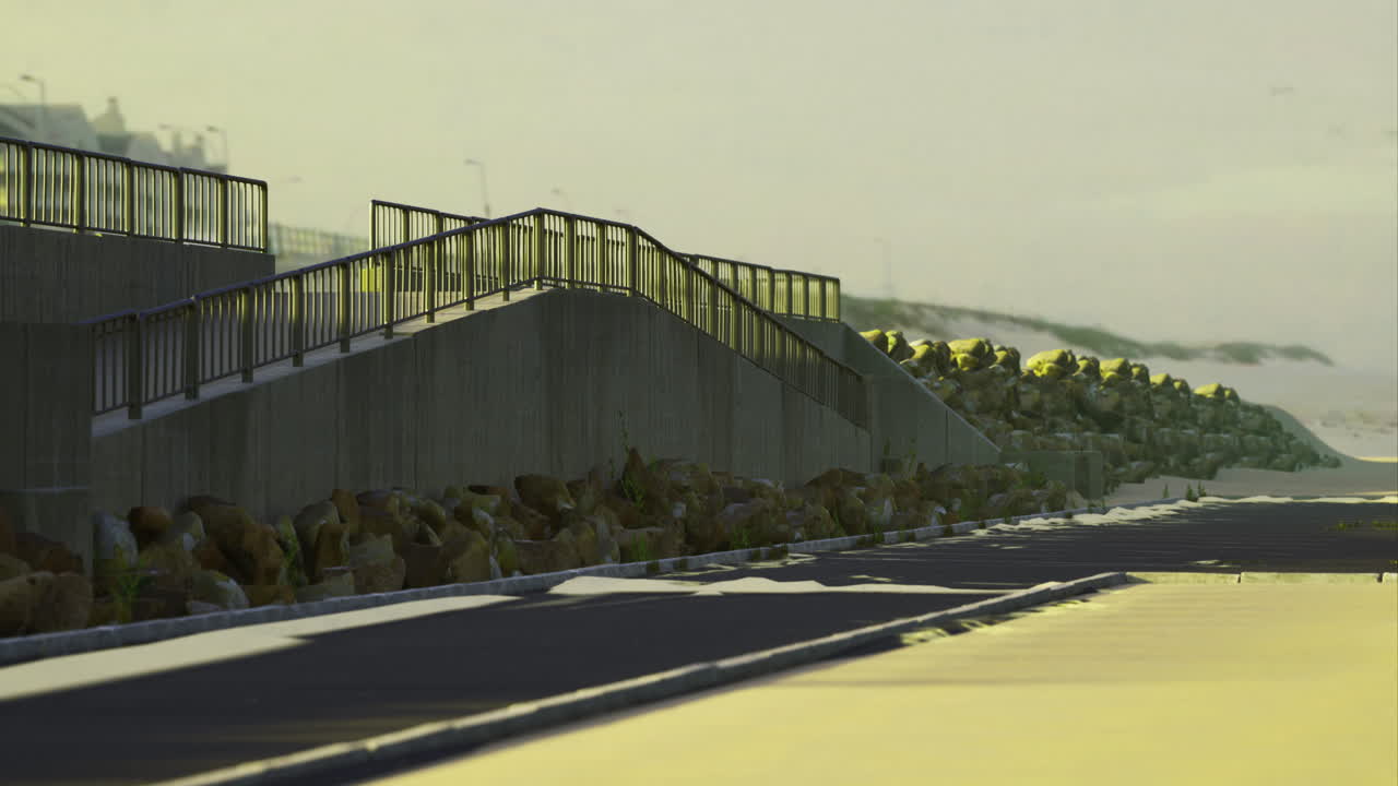 Coastal pathway leading to seaside promenade on a calm sunset afternoon
