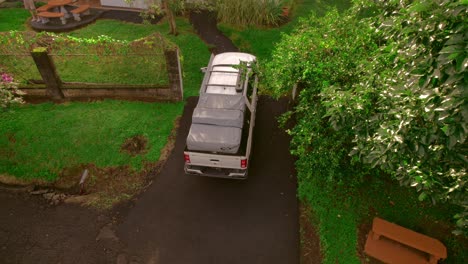 suv, off-road, white car with work equipment, parked in front of the house