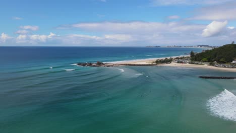 panoramic view of currumbin point and seawall of lillson beach in australian city of gold coast