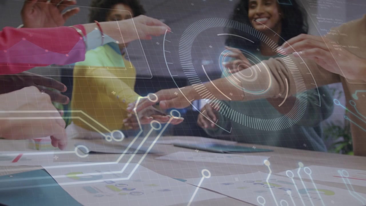 Two women leading tech review pointing at charts activating HUD rings, team joining hands agreeing