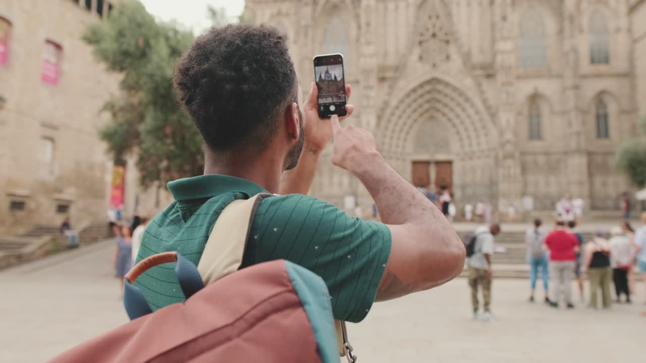 Man taking photo of a building