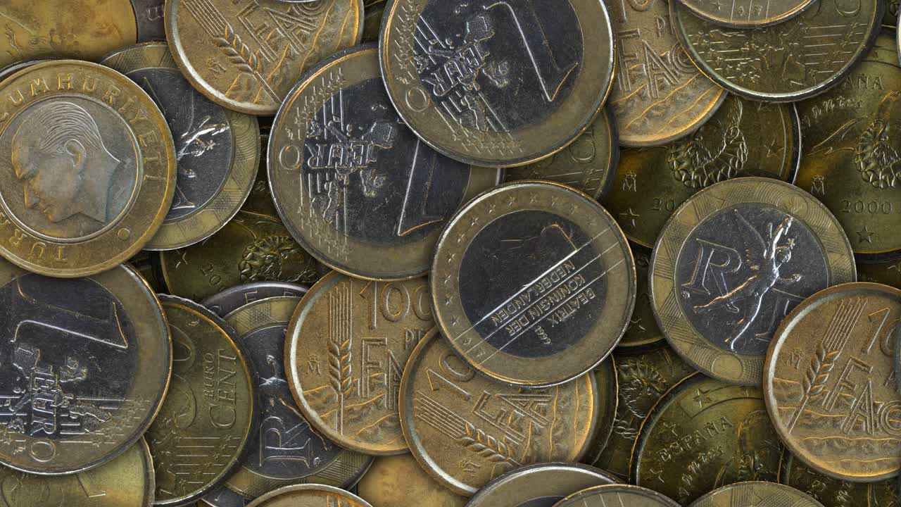 movimiento de fondo de diferentes monedas. bucle sin costuras.