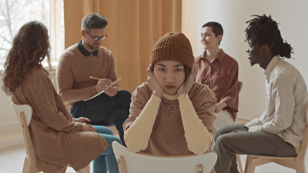 Group therapy session with diverse individuals
