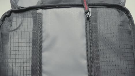 zippering a backpack pocket