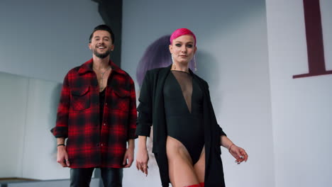 hip hop dancers practicing in modern class. smiling couple dancing for camera.