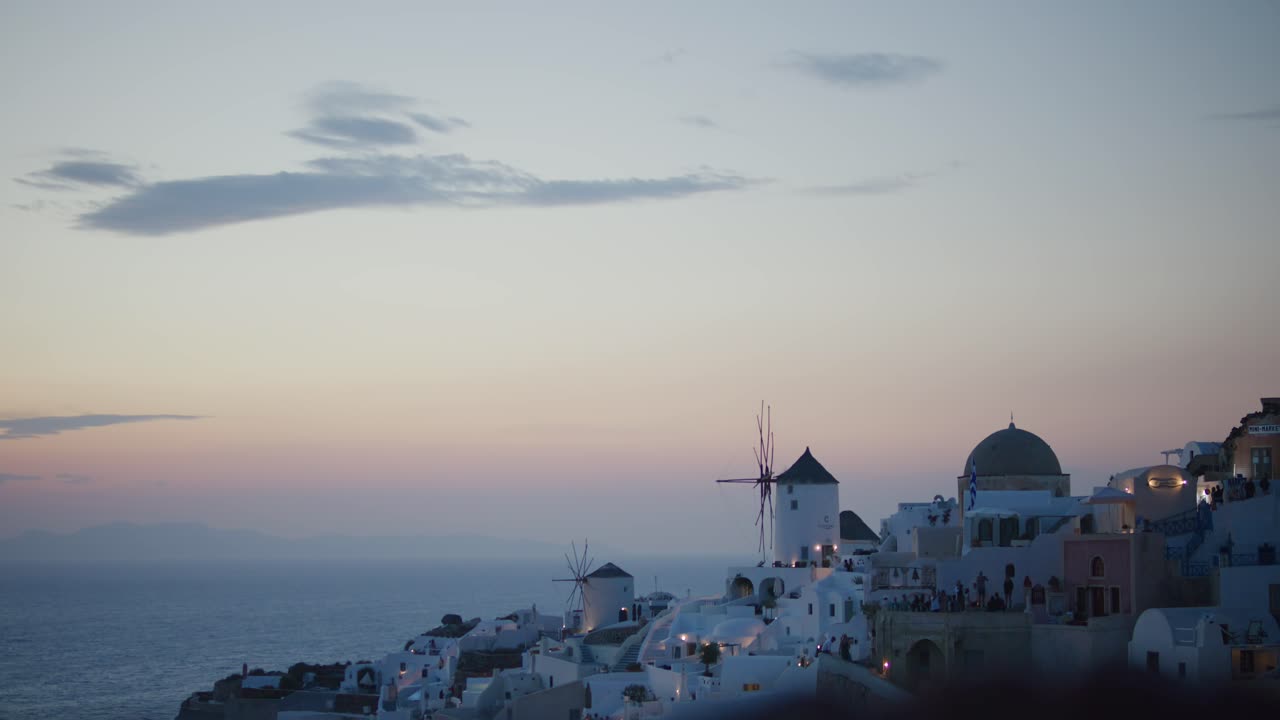 Oia cliffside sunset view in Santorini, Greece